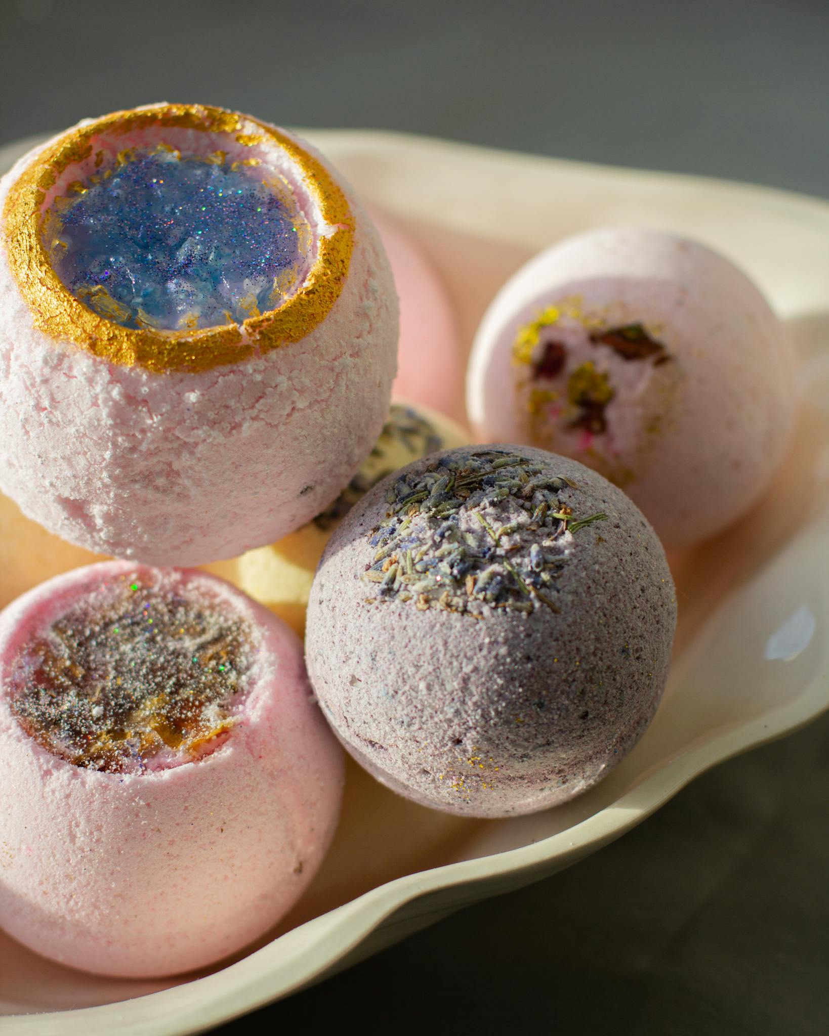 A visually appealing set of artisanal bath bombs on a plate, perfect for relaxation and skincare routines.